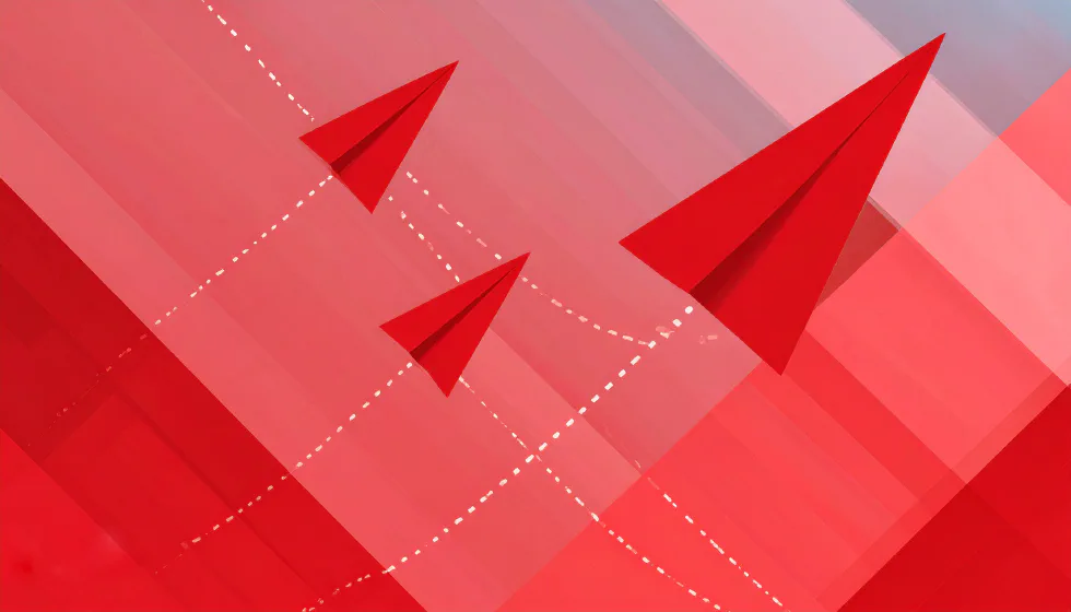 Three red paper planes flying upward on dashed flight paths, the largest leading the way
